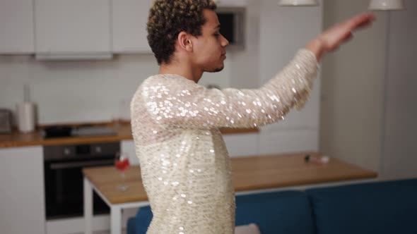 A Man in a Dress Admires Himself Sensually Dancing on the Kitchen alt