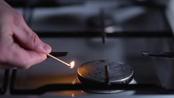 Ignition of a gas stove, close-up, slow motion. alt