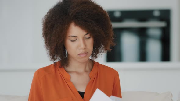 Excited Overjoyed African Woman with Curly Hair at Home Open Envelop with Correspondence Read Good alt