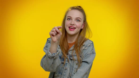 Pretty Adult Girl Pointing to Camera and Looking with Playful Happy Expression Making Choice alt