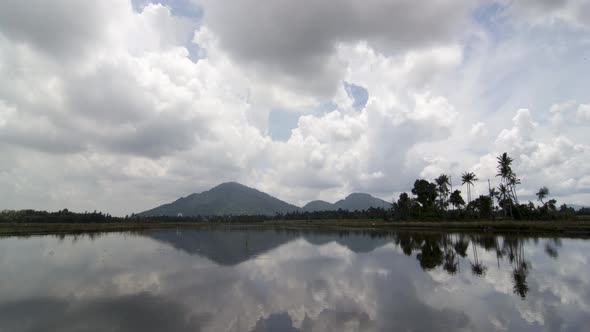 Timelapse cloudy day reflection the Bukit Mertajam hill alt