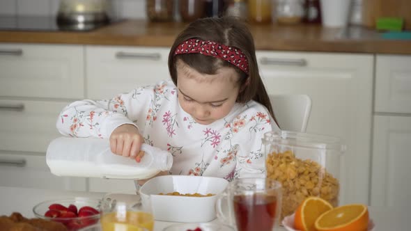 Kid Preparing Breakfast Bowl in Kitchen alt