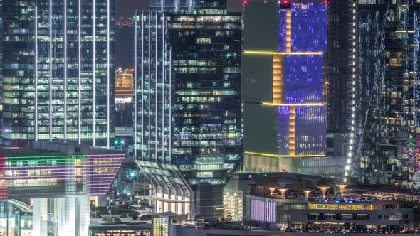Aerial Skyline of Abu Dhabi City Centre From Above Night Timelapse alt