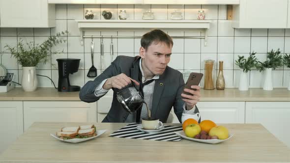 Cinemagraph of Man with Smartphone Pouring Coffee alt