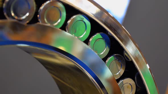 Chrome Surface Of The Roller Bearing Shines Brightly In Different Colors