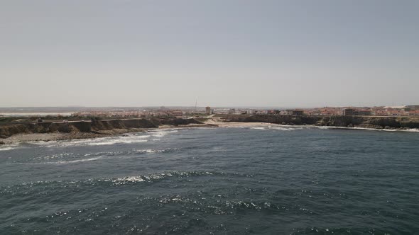 Dolly right Aerial view Peniche Coastline beach view from Ocean, Portugal
