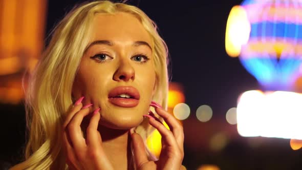 Portrait of Sexy Blonde Woman on Las Vegas Strip at Night Slow Motion alt