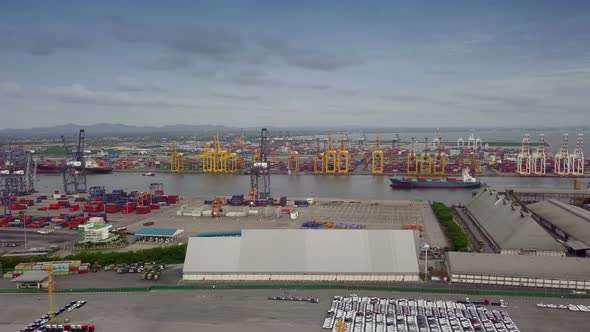 Aerial view of logistics concept of commercial vehicles, cars and pickup trucks waiting to be load o alt