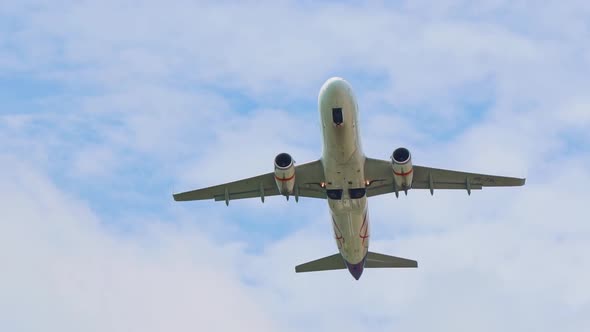 Plane Takes Off From the Airport the View From Below From the Ground Wings Against the Sky alt