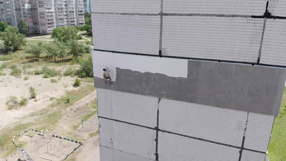 Industrial Climber Painting Building Facade Wall, Insulation Work, Aerial View alt