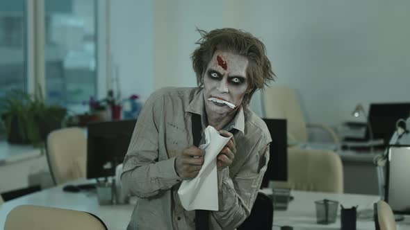 Portrait of Zombie Man Eating Document in Office alt