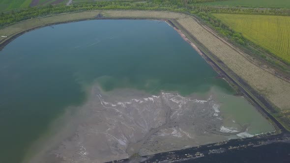 Aerial Video of an Ash Dump. The Pipeline From Which the Products of Coal Combustion Are Discharged