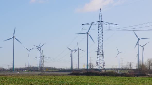 Agrar Landscape with Electricity Pylon, Highway and Windmills alt