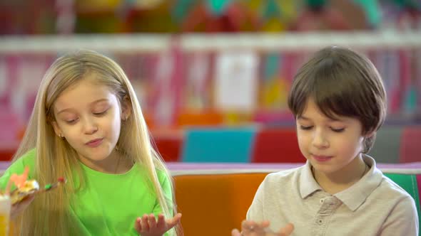 feeding boy with girl