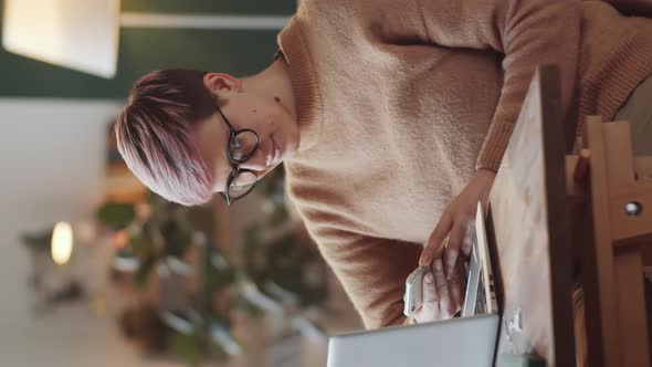Cheerful Woman Using Smartphone at Home alt