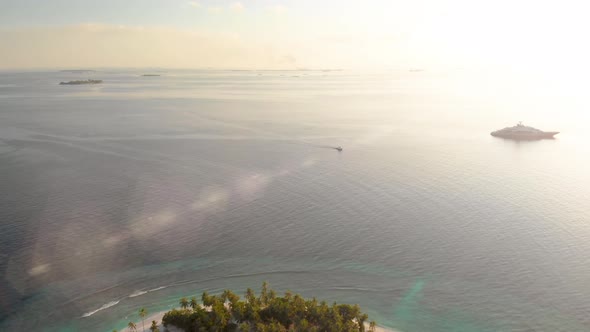 Flying above tropical island on sunset alt