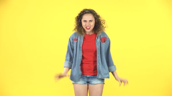 Angry Woman Is Very Screaming, Gesturing with Her Hands, Covering Her Ears at Studio alt