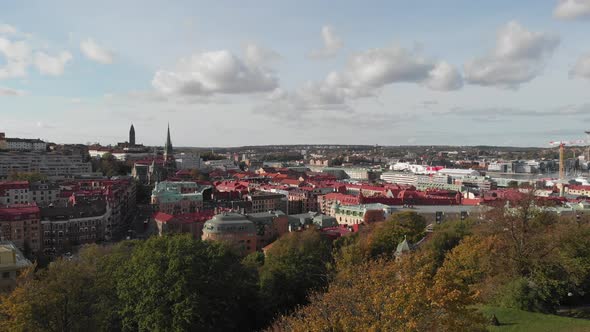 Gothenburg City Center Reveal Behind Trees Aerial Rising alt