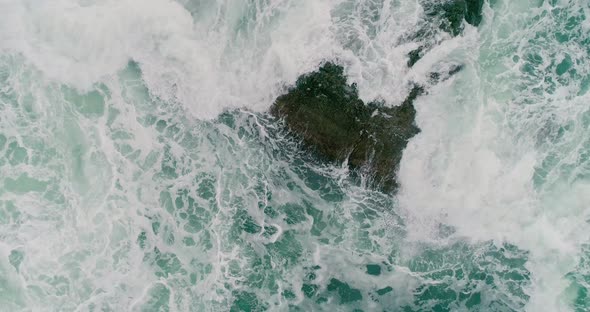 Sea Waves on the Rocks
