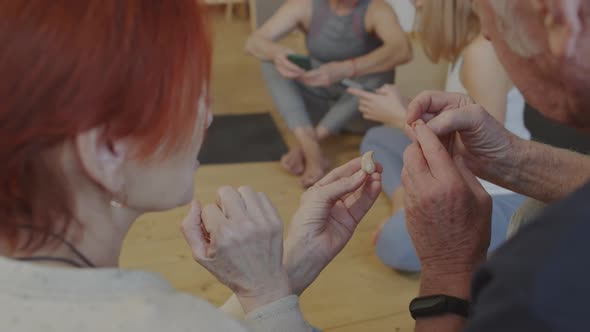 Seniors Talking about Hearing Aid alt