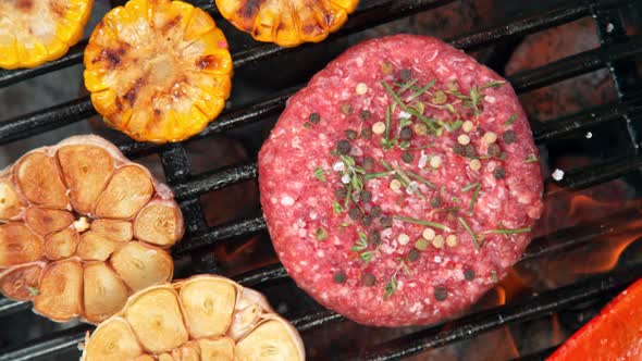 Super Slow Motion Top Shot of Falling Fresh Minced Meat with Spices on Grill at 1000 Fps alt