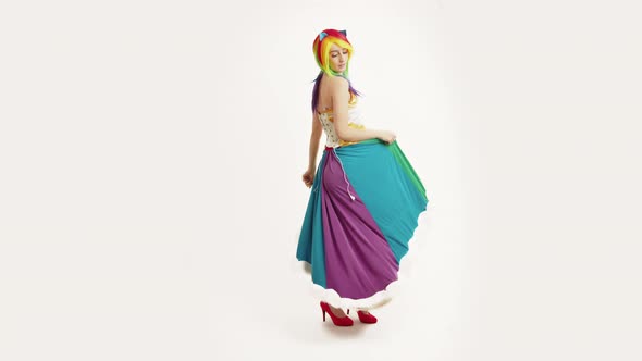 Caucasian Girl With Rainbow Hair Playing With Her Rainbow Dash Skirt White Background Full Studio alt