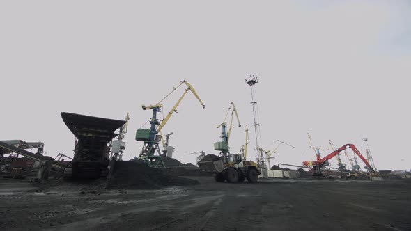 Industrial Port Belt Conveyor Into Which Coal is Loaded