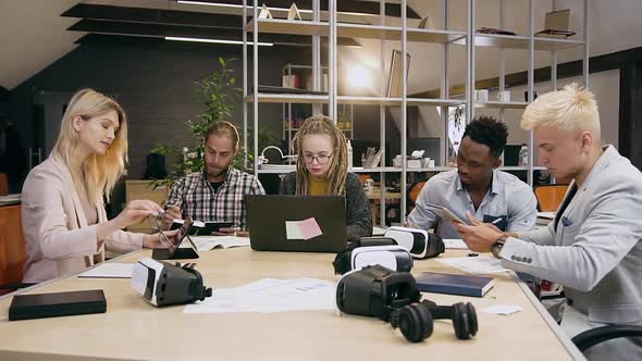 Attractive Concentrated Creative Multiracial Group of People Working Together in Boardroom alt