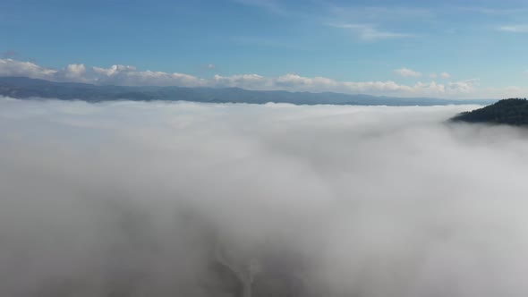Drone view of clouds in Umbria, Italy