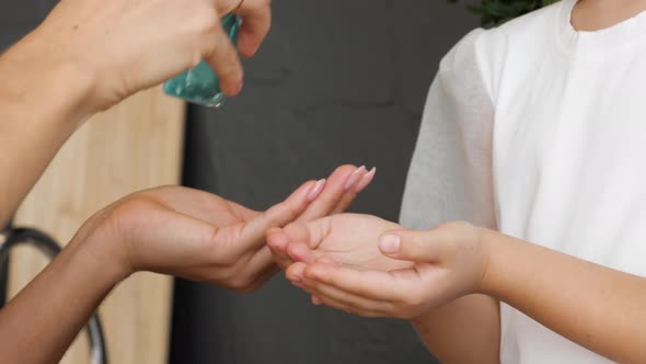 Couple Sanitizing Hands