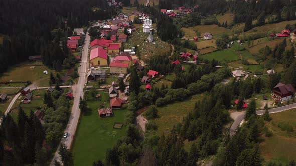 Dramatic aerial tilt up reveal of Arieseni Apuseni National Park Transylvania Romania alt