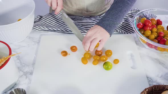 Time lapse. Step by step. Cutting vegetables on a white cutting board to make a one-pot pasta recipe alt