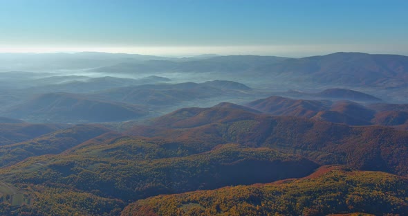 Beautiful Landscape in the Mountains at View of Hills Covered By Morning Foggy alt
