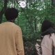 Man and Woman walk around forest looking for mushrooms - VideoHive Item for Sale