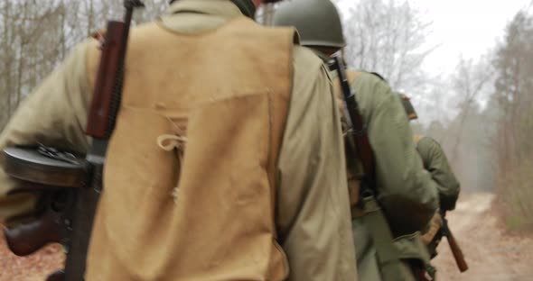 Historical Re-enactment. Re-enactors Dressed As American Soldiers Of USA Infantry Of World War II alt