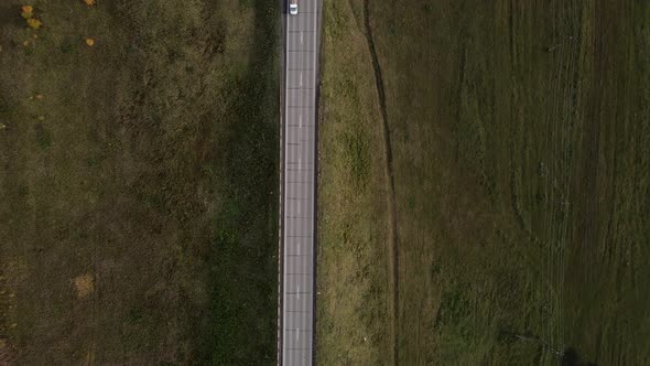Aerial Top Down  View of Car Traffic Driving on Country Road