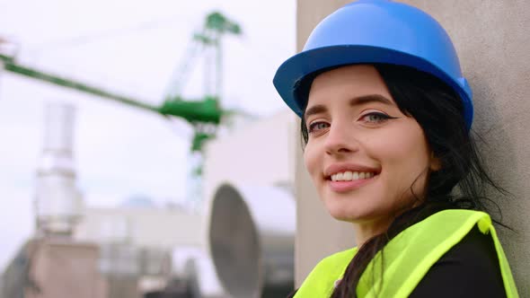 Good Looking Female and Young Engineer Smiling alt