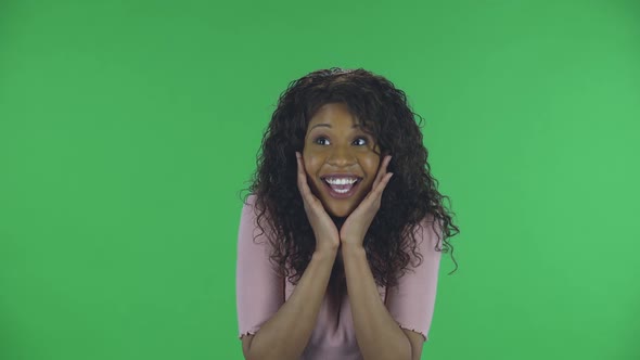 Portrait of Beautiful African American Young Woman Is Looking at Camera with Shocked and Surprised alt