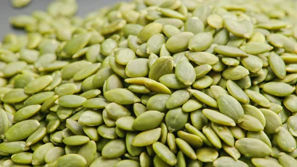 Peeled Pumpkin Seeds Fullframe Spinning Background alt