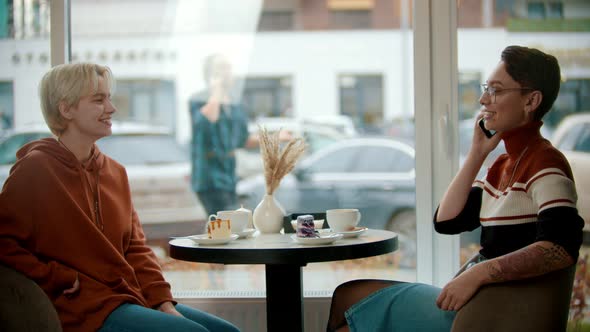 Young Girl Is Talking on the Phone with Her Friend alt