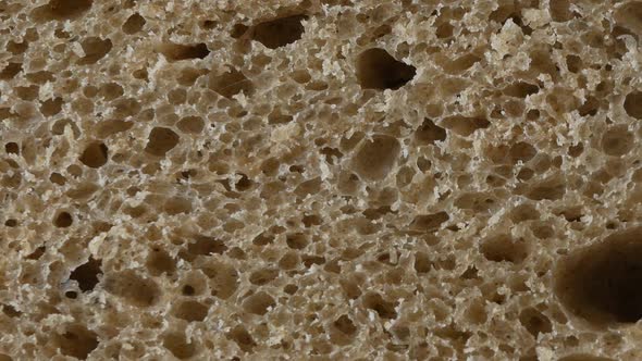 A slice of brown bread, up close alt