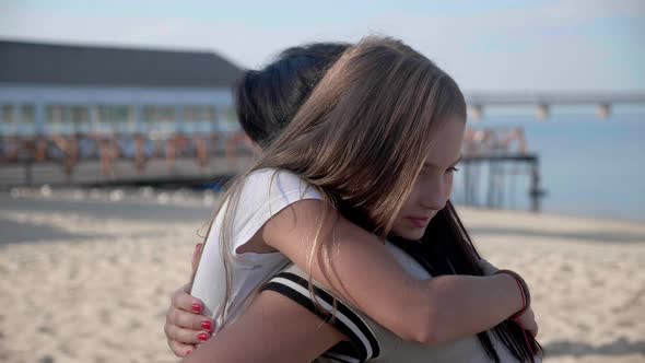 Happy Cute Affectionate Adopted Little Kid Girl Hugging Foster Care Parent Mother with Eyes Closed alt