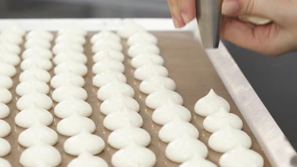 Confectioner Using Pastry Bag Preparing Meringue Cookies alt