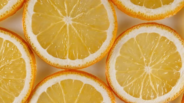Macro Shot of Sliced Orange Fruit Slices and Rotate alt