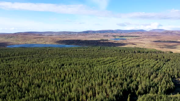 Flying From Slieve League Towards Lough Auva in County Donegal  Ireland alt