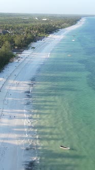 Vertical Video Boats in the Ocean Near the Coast of Zanzibar Tanzania alt