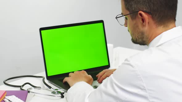 Doctor Scrolling Chroma Key Laptop at Medical Cabinet alt