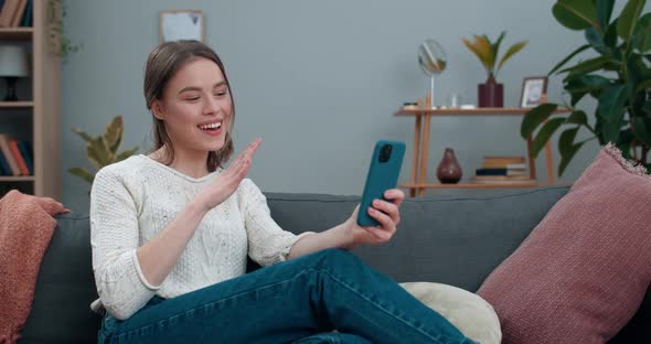 Deaf Millennial Woman Having Video Call and Showing with Sign Language Phrase Fine News Whilw alt
