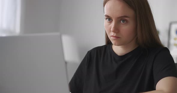 Eeducation of Young Female Student at Home Person Is Learning By Internet Using Laptop Making Notes alt