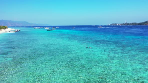 Luxury fly over abstract shot of a white sand paradise beach and aqua blue water background in color alt